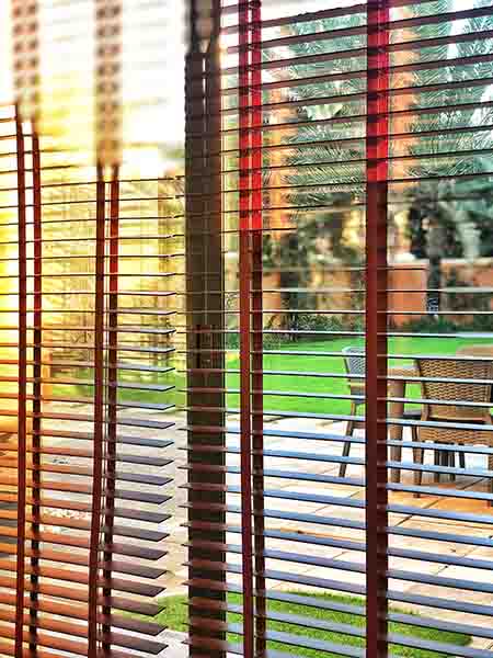 Outdoor blinds filtering out morning light