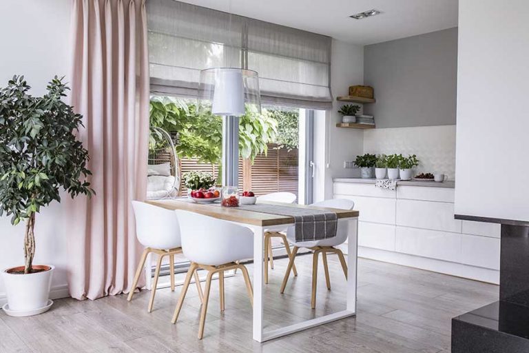 pastel curtains and blinds set in kitchen of home