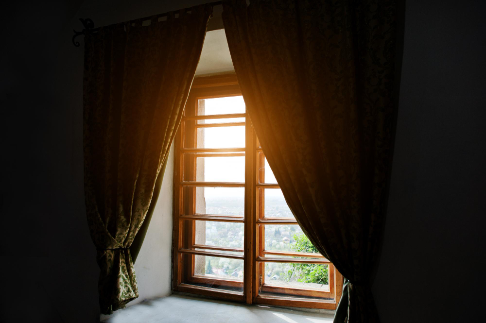 Wooden balcony with a grand thick curtain overlaying