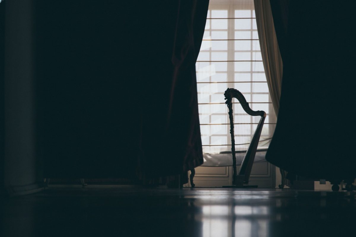 Blackout curtains sound reduction blocking sunlight and external noise through a window in a quiet home interior.